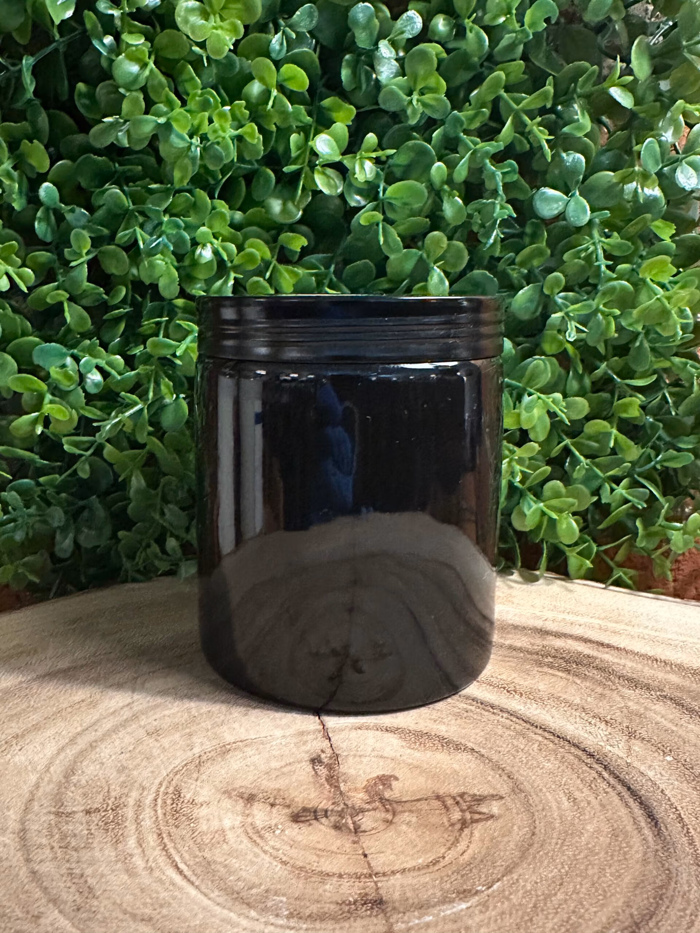7oz Soy Candle Side A habdmade scented candle made with 100% soy wax by The Lighthouse Candle Factory in a gloss black ceramic jar with matching lid.