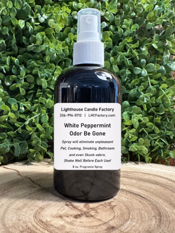 8 oz. White Peppermint Odor Be Gone (OBG) all-purpose fragrance spray by The Lighthouse Candle Factory in a dark bottle with a white fine mist sprayer.