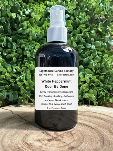 8 oz. White Peppermint Odor Be Gone (OBG) all-purpose fragrance spray by The Lighthouse Candle Factory in a dark bottle with a white fine mist sprayer.