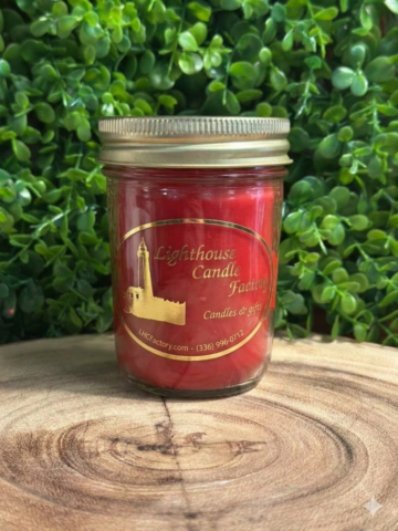 Apple Bourbon Candle in an 8oz jelly jar candle with chili red wax — front view