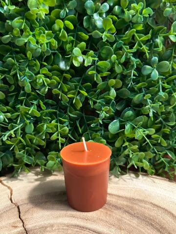 The Smoked Old Fashioned Votive Candle by The Lighthouse Candle Factory in bourbon color with smoky oak and bourbon fragrance notes