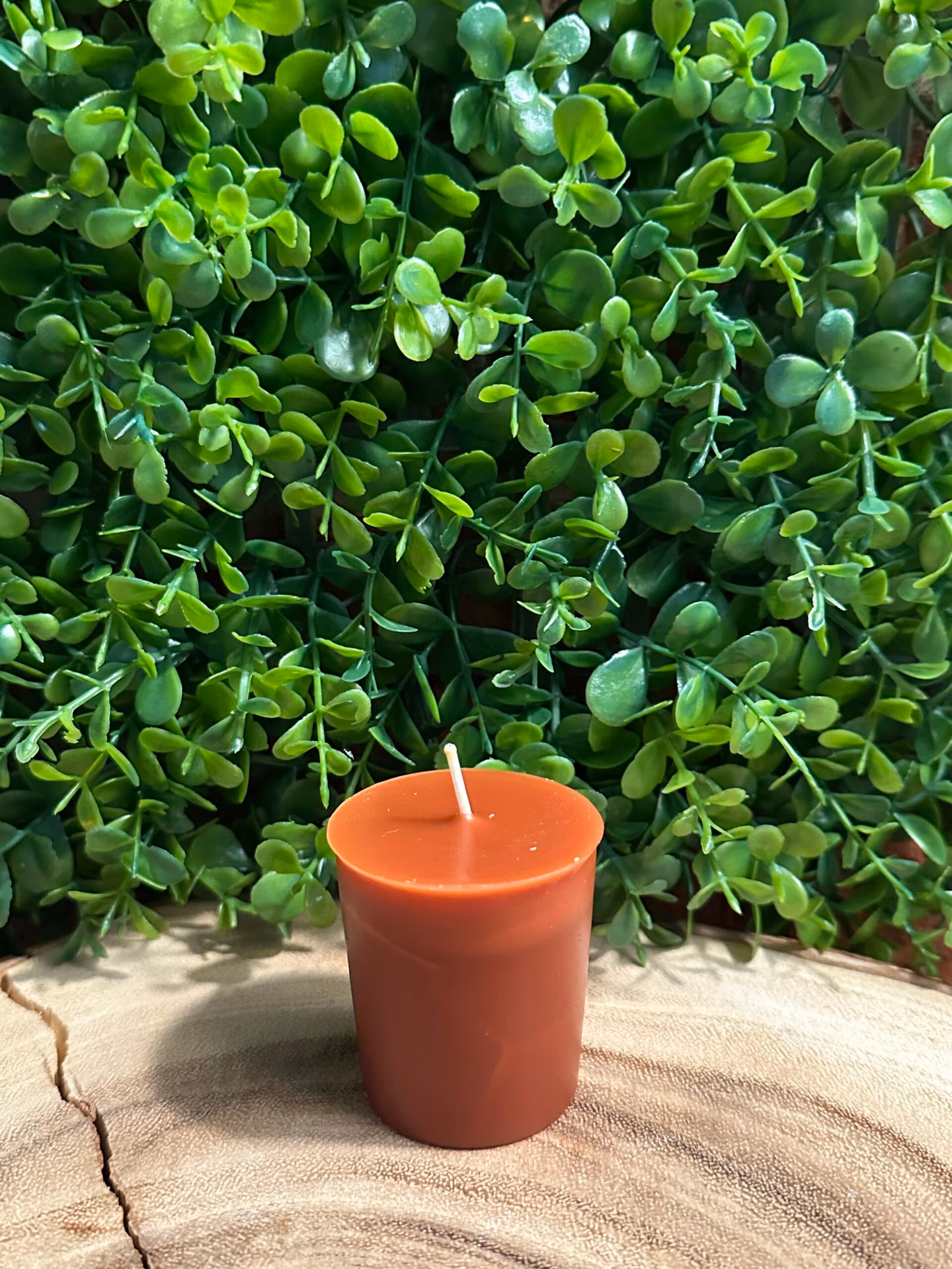The Smoked Old Fashioned Votive Candle by The Lighthouse Candle Factory in bourbon color with smoky oak and bourbon fragrance notes